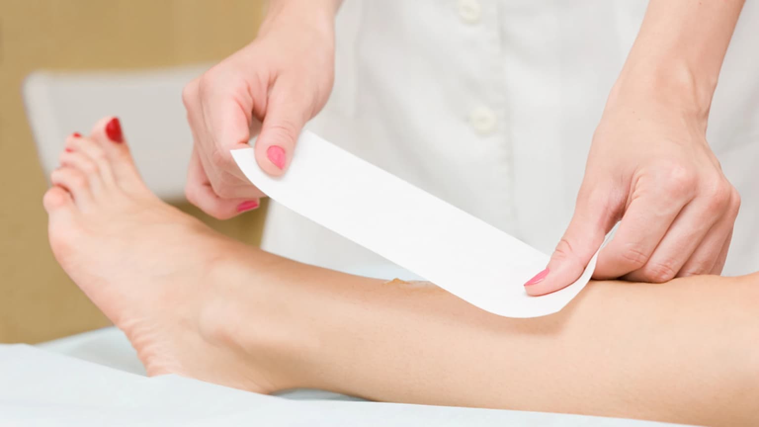 customer receiving a leg waxing treatment 